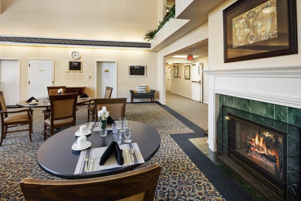 Dining area with tables and a fireplace