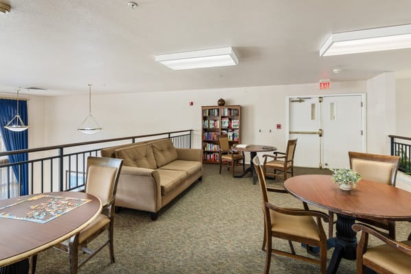 Common area with seating and bookshelves