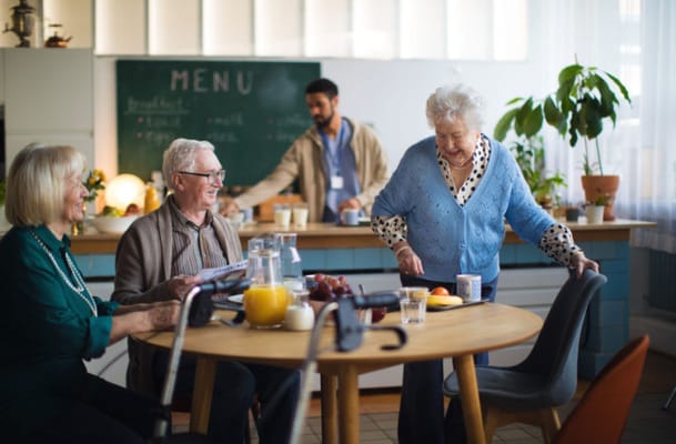 Residents enjoying breakfast in a communal dining area