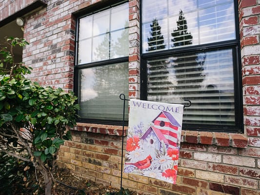 Welcome sign by a window at a senior care facility