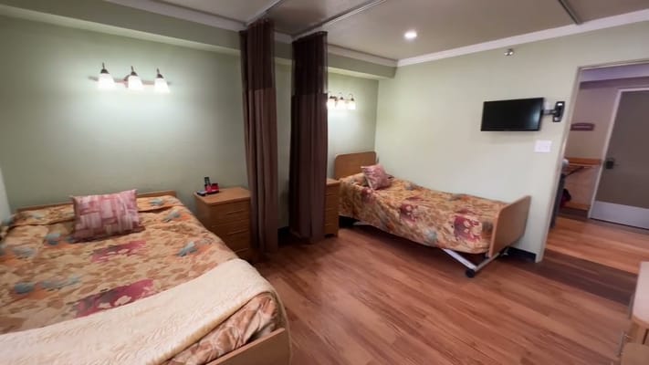 Interior view of a shared resident room with two beds