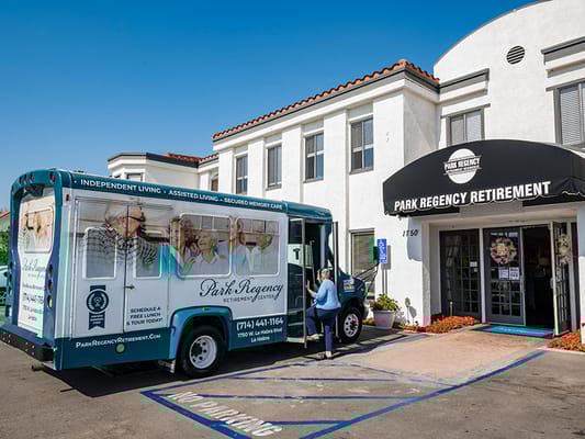 Facility entrance with transport vehicle parked