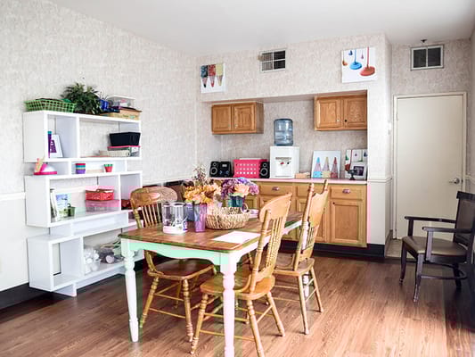 Bright dining area with wooden table and decorations
