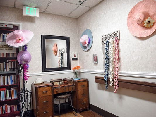 Decorative room with hats and leis in a common area