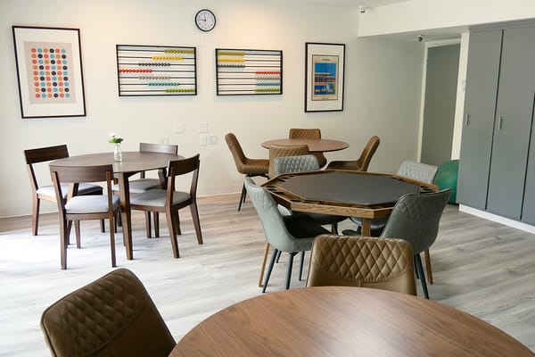 Bright common area with tables and chairs