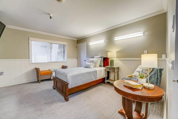 Cozy private resident room with a bed and decorative elements