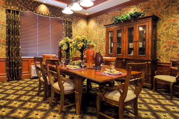 Elegant dining room set for a meal with flowers