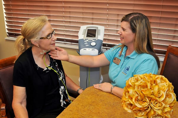 A staff member assisting a resident in a care facility
