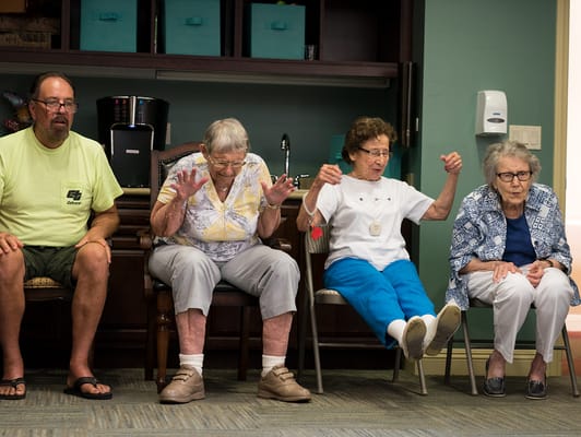 Residents engaging in a group activity in the common area