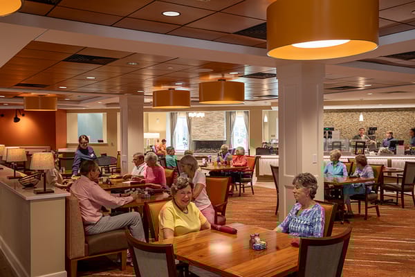Residents enjoying lunch in a bright dining room