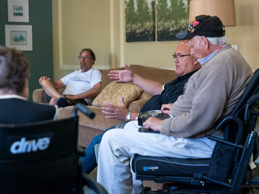 Residents engaged in conversation in a common area