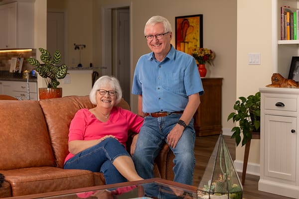 Couple posing comfortably in a modern living room