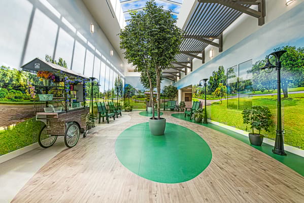 Interior view of a vibrant common area with greenery