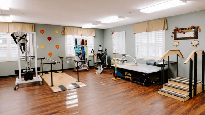 Interior view of a physical therapy room with equipment