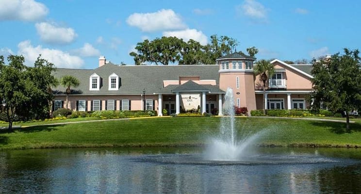 Exterior view of Marsh's Edge facility with pond and fountain