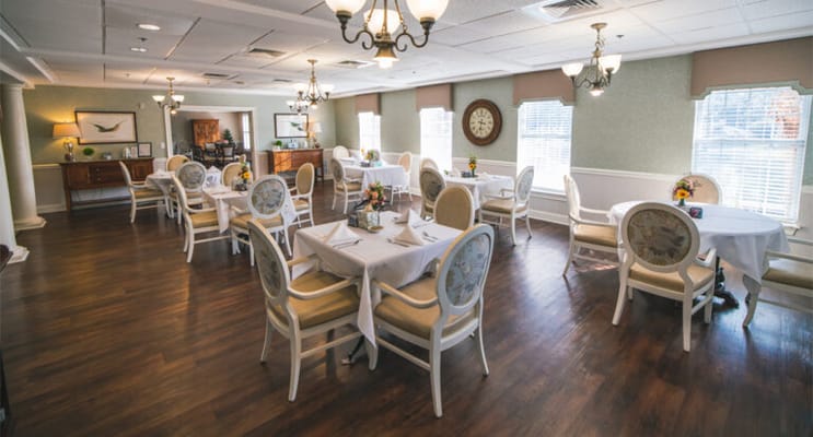 Dining room with tables set for residents