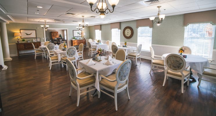 Dining room with tables set for residents