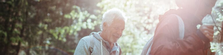 Residents enjoying a walk in a lush outdoor setting