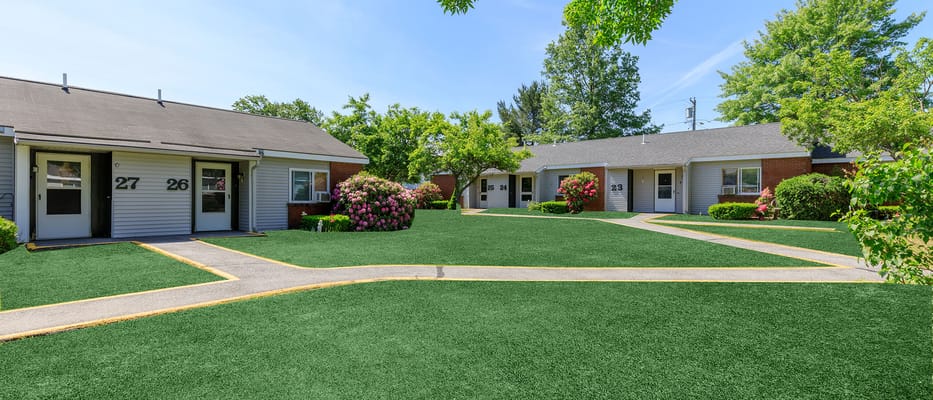 Well-maintained outdoor area with paths and greenery
