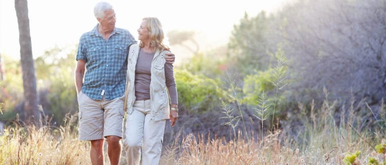 Couple walking together in a serene outdoor setting
