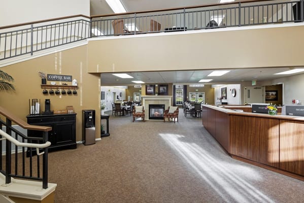 Interior shot of a common area with seating and fireplace