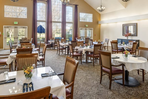 Dining room with tables set for residents