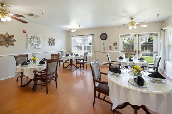 Dining room with tables set for a meal