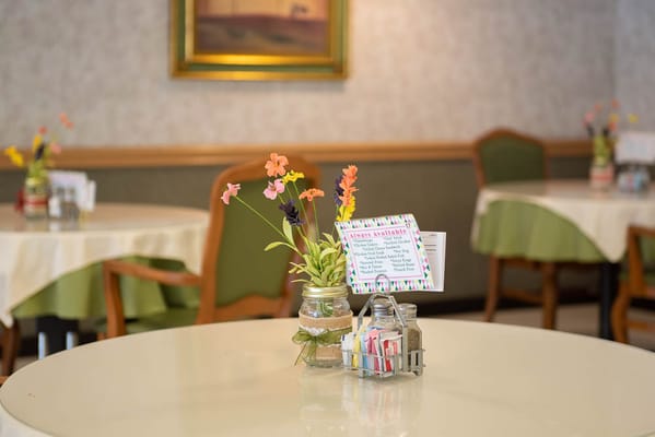 Dining table setup in a bright dining room