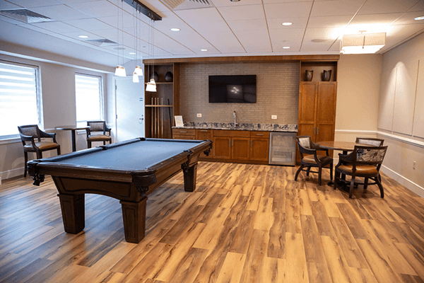 Cozy game area with a pool table and seating