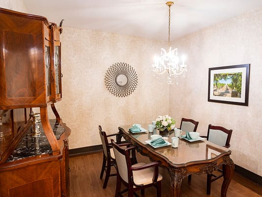 Elegant dining room with table set for a meal