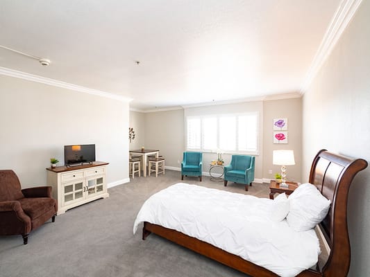 Interior view of a private resident room with furniture