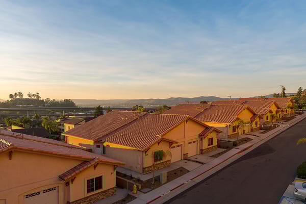 Row of residential buildings at sunset