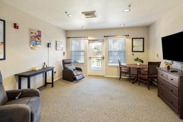 Cozy interior of a resident room with seating