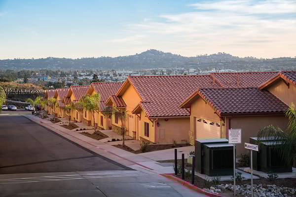 A row of single-story residential units in a senior living community