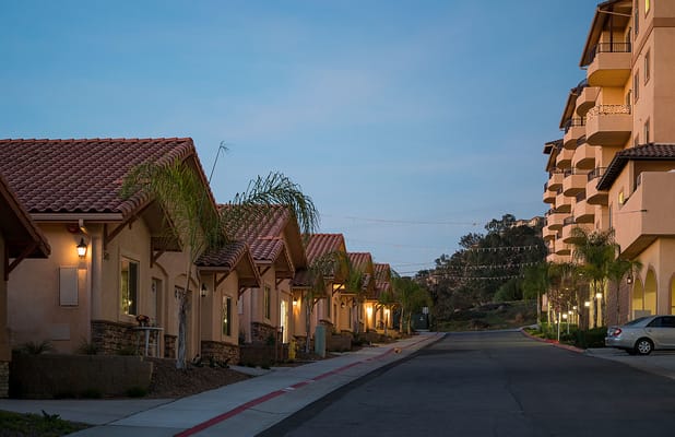 Evening view of the facility's exterior and cottages
