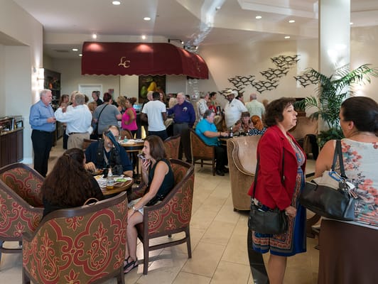 Residents and staff gathered in a lively common area