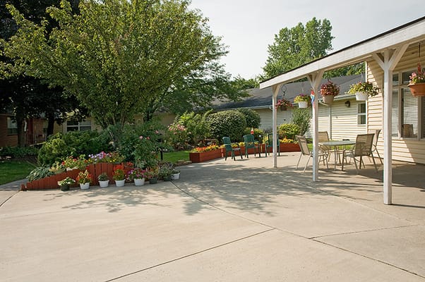 Outdoor patio area with plants and seating