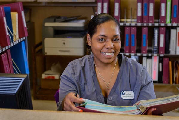 Staff member assisting at the front desk