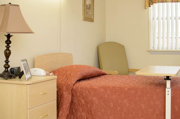 Cozy resident room with bed and furnishings