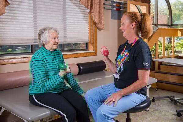 Residents participating in an exercise therapy session