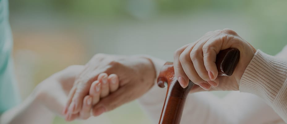 Close-up of hands connecting, symbolizing care