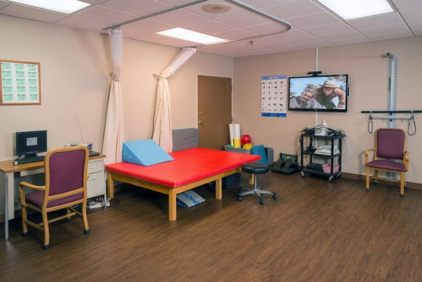 Interior view of a therapy room with equipment