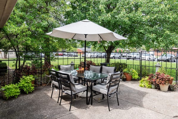 Outdoor seating area with a table and umbrella