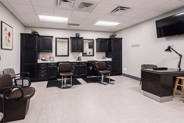 Interior view of a salon area with styling chairs and mirrors