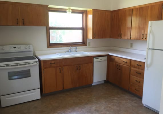 Bright kitchen area with wooden cabinets
