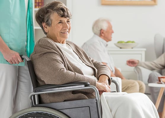 Smiling elderly resident in a cozy common area
