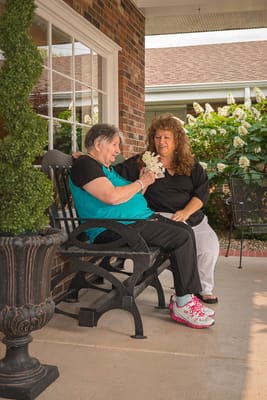Residents engaging in conversation on a patio