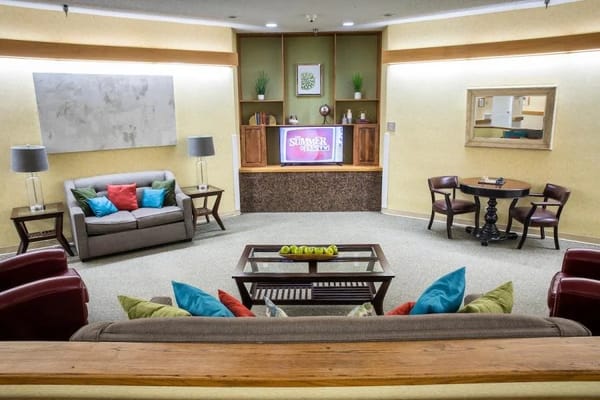 Common area with seating and decor in a nursing home