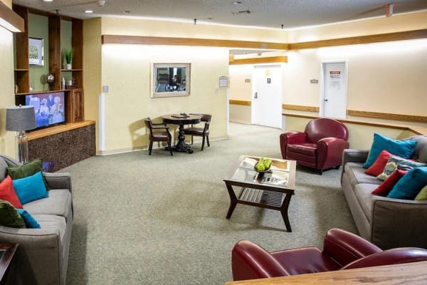 Bright common area with seating and television