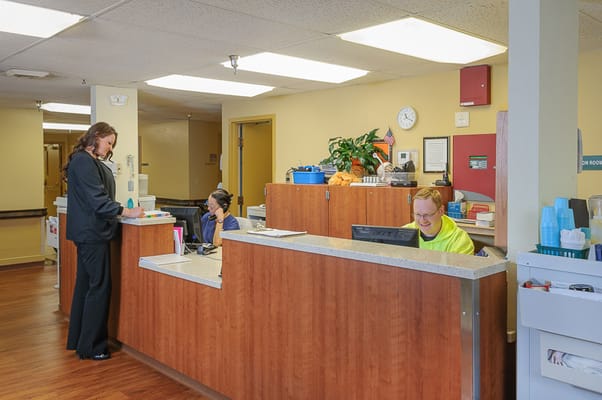 Staff attending to residents at the reception area